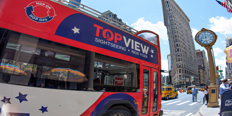 a TopView Double Decker Hop-on Hop-off Bus on the Street 