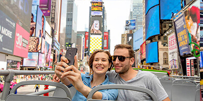 a Young Couple Taking Selfies in Time Square